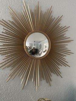 Beautiful Modern Brass/Gold starburst mirror. 40 in wide. Mirror in the middle is 12 in wide
