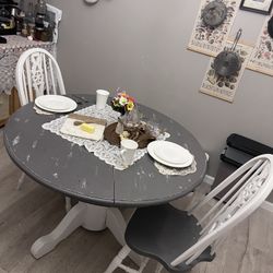30 inch tall 36 inch table with two chairs