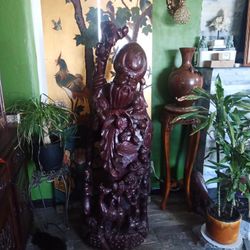 vintage hand carved solid wood statue of the god of longevity. is carved from a whole piece of wood and is 5 feet tell. high 60" .
witdth 20"