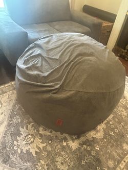 Cordaroy bean bag chair that converts into a full-size bed.