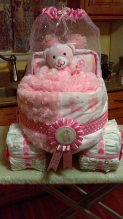 Baby girl Diaper carriage cake for that special baby shower. Order yours today.