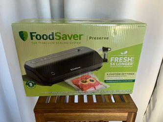 New in the sealed box FoodSaver Multi-Use Vacuum Sealing and Food Preservation System.