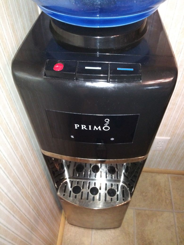 Primo water dispenser with 3 5gal.Bottled water