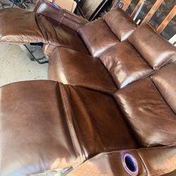 Real leather couch - 2 recliners and adjustable center counsel