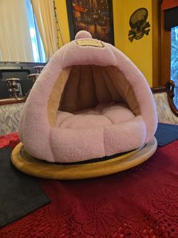 Cozy pink cat bed.