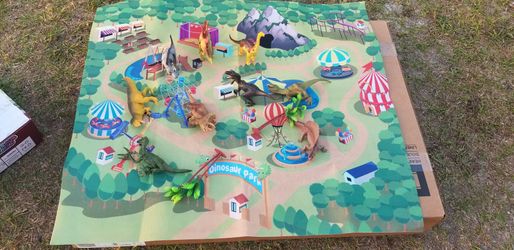 Mat with plastic dinosaurs