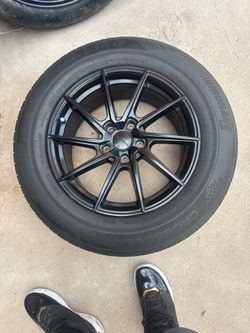 Black rims with tires