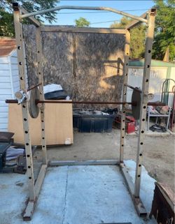 Squat rack+ Olympic bar+ 2x45lbs