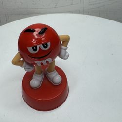 Collectible figurine of the Red M&M's character.