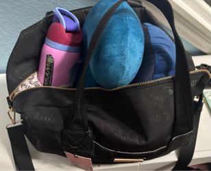 New bag with used bottle and neck pillows