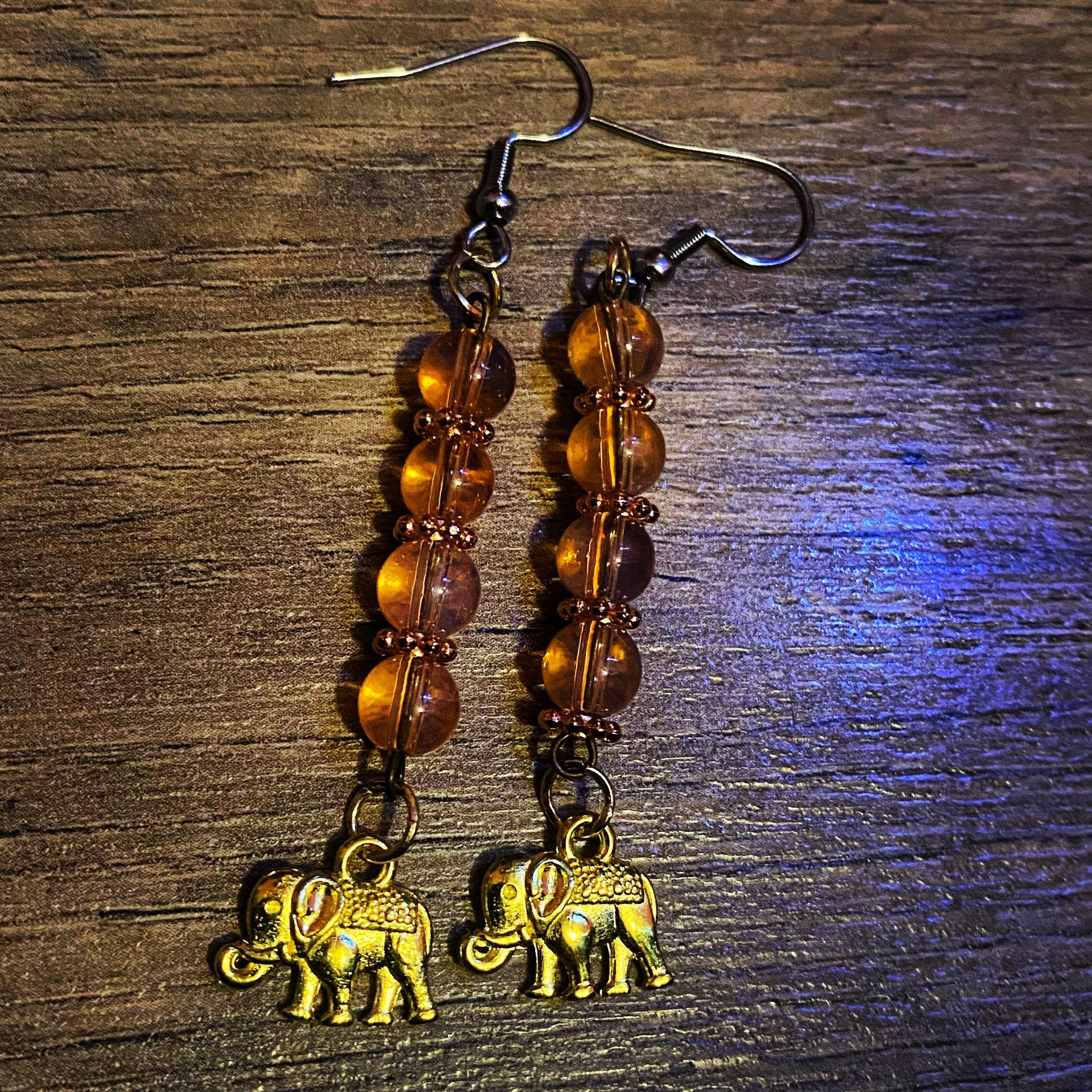 **Gold Elephant Dangle Earrings - Elegant & Unique Jewelry Piece**