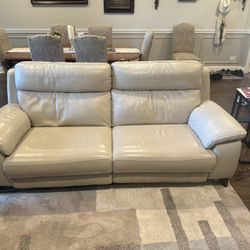 Leather couch with electric leg and head rests $675 Or Best Offer