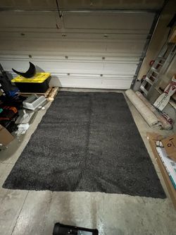 Free dark grey shag rug