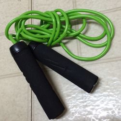 green and black skipping rope