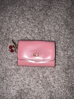 Coach pink wallet with mini cherry charm and heart