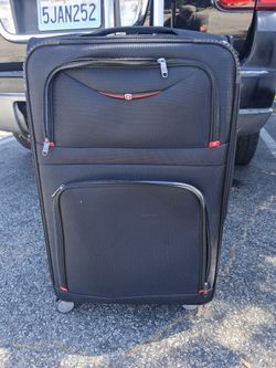 Large new suitcase on wheels.