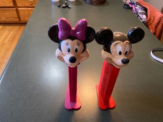 Large Disney Pez dispensers, holds full packs. Approximately 12 inches tall.