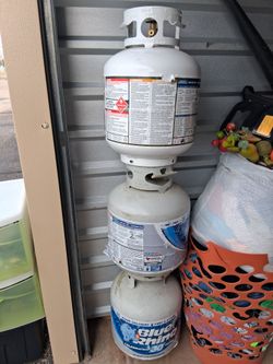 3 propane tanks 2 empty and 1 full