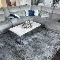 Gray Sectional Sofa with Coffee Table and Lamp