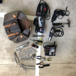 Tools drill hammer pliers battery charger sander jigsaw