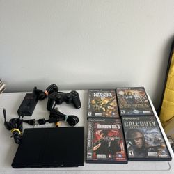 PS2 Slim And 4 video games   