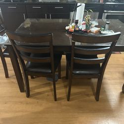 Ashley Dining table with 4 chairs  and 1 bench(1 chairs broken top part but still usable)
