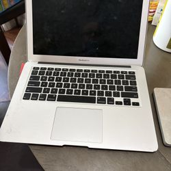 Apple Mc Book.    And Apple DVD Player 