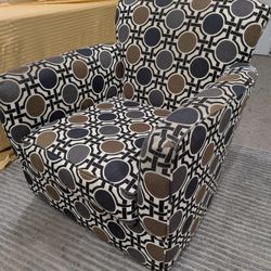 360 Swivel Accent Chair With A Black, Brown, Gray And White Geometric Circle Pattern.