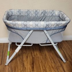 Practically New Portable Folding Rocking Bassinet ( Used Once). Price Firm!!