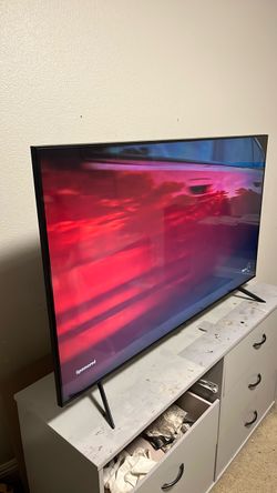 Samsung 55” smart television with remote.