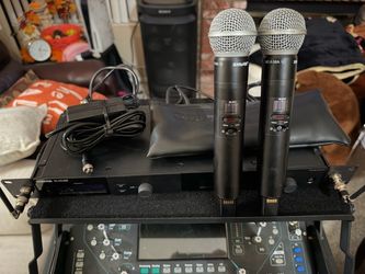 Shure SLX-D system that includes 2 mic beta 58A transmitters