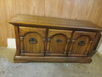 Solid wood cabinet.  2 doors. 1 drawer.  
4ft 8 long x 1ft 6 wide x 2ft 4 tall