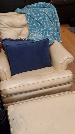 Chair and rolling footstool. Cream color, leather