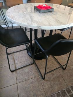 Round table and 4 leather chairs