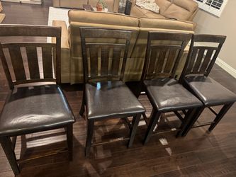 4 brown dinner table chairs