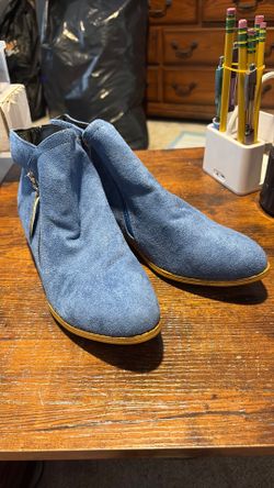 Female blue Swede low cut boots.
