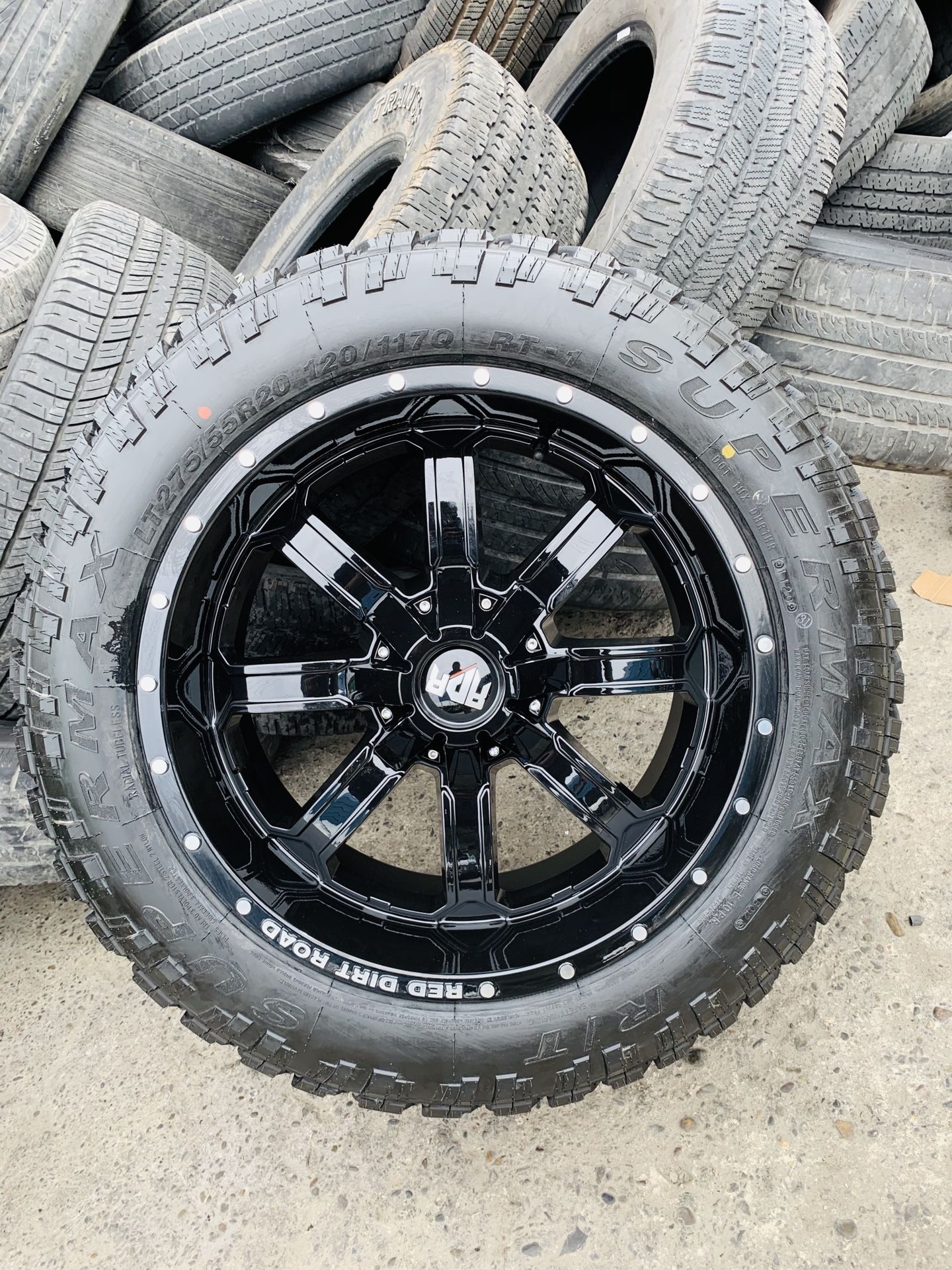 20x10 All gloss black new rims and mud RT off road tires 6 lug Chevy gmc Toyota Nissan Ford