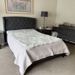 Dark grey bed with frame and rails