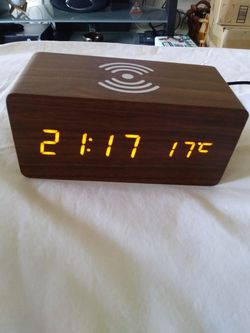 Clock with wireless charging station for phones