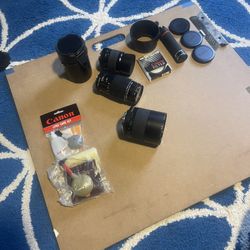 Assortment of Pentax camera lenses and other various camera accessories
