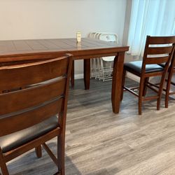 Used Table 4 Chairs 1 Bench 