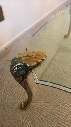 Elegantglass, top with solid brass decorative legs Elegant glass, top with solid brass decorative legs