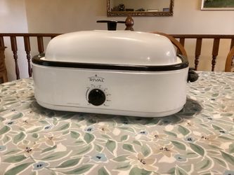 Rival 14-Quart Roaster Oven countertop appliance capable of roasting turkeys up to 20 pounds.