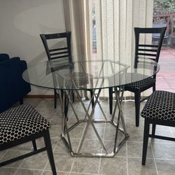 Silver 48” Round Chrome & Glass Top Table