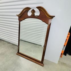 Beveled Mirror In A Decorative Wall All Wood Frame.