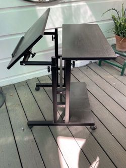 📍Reduced📍 SIDUCAL mobile standing desk features a black finish and adjustable tilting top for versatility