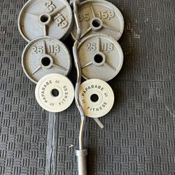 140lbs of Olympic weights with curl bar