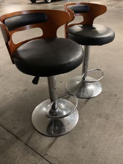2 bar stools with wood backing