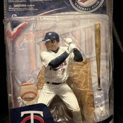 This is a McFarlane Toys MLB Series 27 Joe Mauer action figure