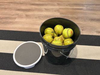 26 softball balls with buckets